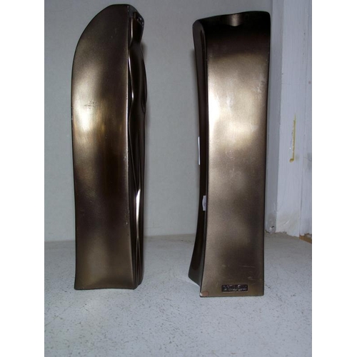 107 - A pair of modern candle holders