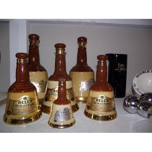 121 - A quantity of Wade bells in various sizes and Yorkshire liqueur and Irish whisky stoneware ewes, all... 