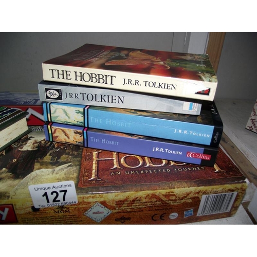 127 - A Hobbit Monopoly (includes all pieces) and various copies of the Hobbit including hardback