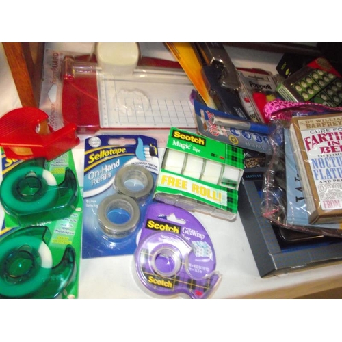 154 - A mixed lot of new items including sellotape, gas lighters, travel clock, photo frame etc