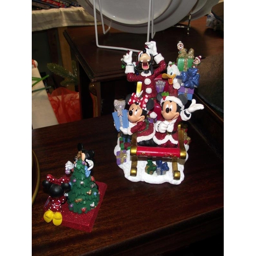 175 - A quantity of Christmas ornaments including Disney plus a good lot of wrapping paper, mostly still s... 