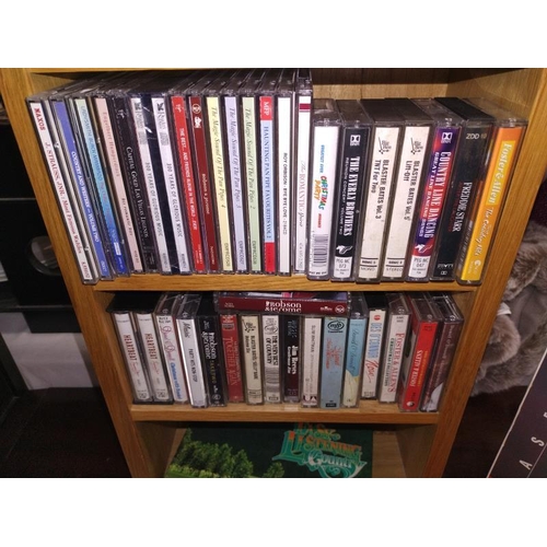 178 - A quantity of music CD's including Country, the 3 tenors etc. including CD storage case