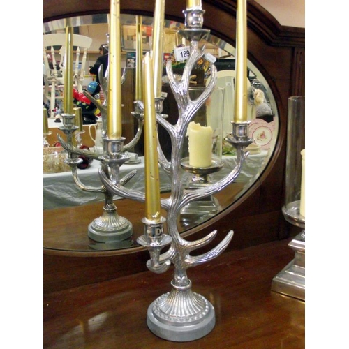 190 - A pair of candlestick holders by culinary concept, London and an antler candelabra height 51cm