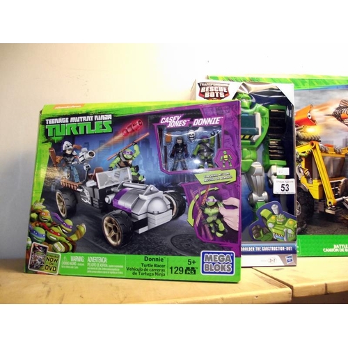 53 - 2 sealed teenage Mutant Ninja Turtles mega blocks sets and a Transformers rescue bots COLLECT ONLY