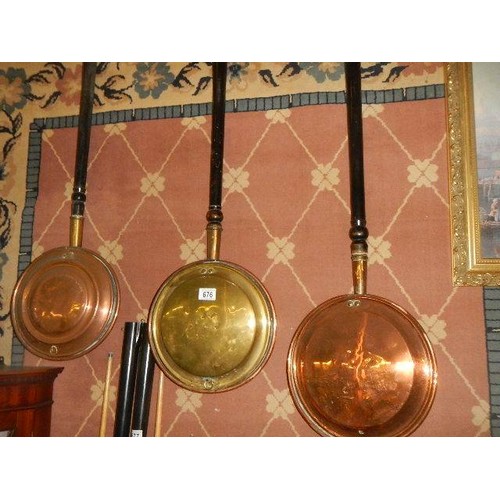 676 - Two copper and a brass warming pan.   COLLECT ONLY.