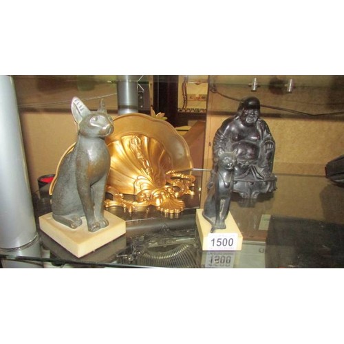 1500 - A Buddha, two Egyptian cats and a gilded wall bracket.