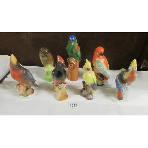 1512 - Seven parrot figures.