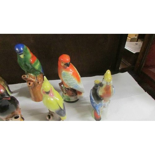 1512 - Seven parrot figures.