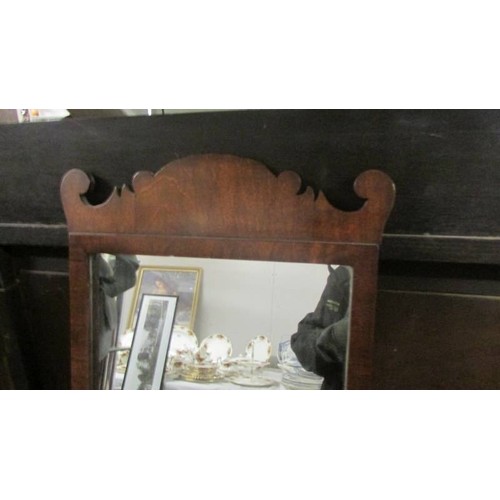 1523 - A mahogany framed mirror. COLLECT ONLY.