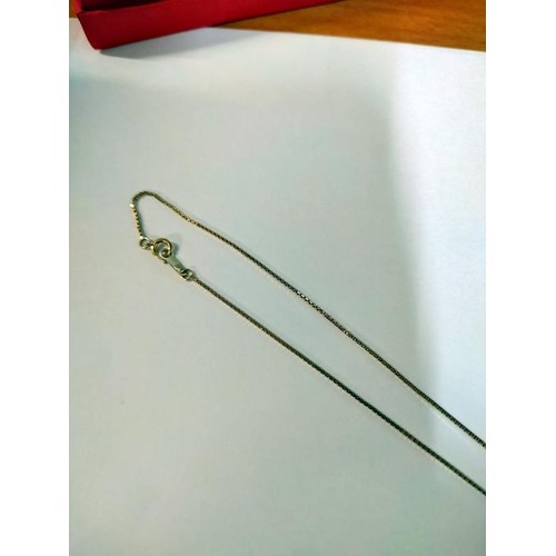 1003 - A 9ct gold pendant on 9ct gold chain, 2.6 grams. Length of chain 42cm