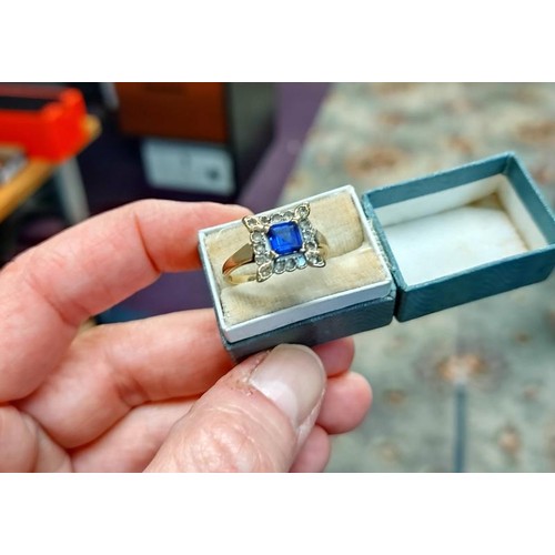 1035 - A square sapphire and diamond ring in yellow gold, size N half.