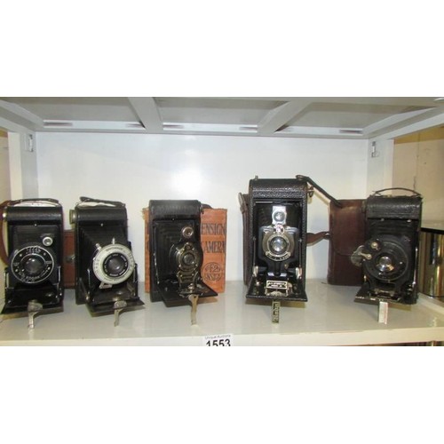 1553 - Twelve vintage folding camera's.