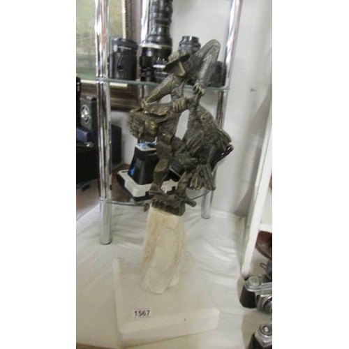 1567 - A contemporary metal figure on a marble base. COLLECT ONLY.