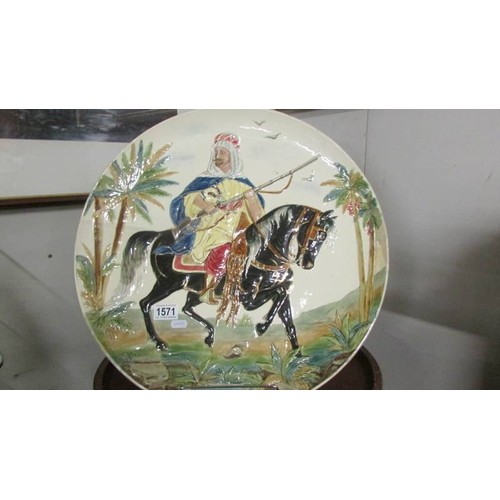 1571 - A large hand painted charger of an Arab on horseback, a/f.  COLLECT ONLY.