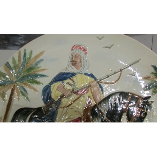 1571 - A large hand painted charger of an Arab on horseback, a/f.  COLLECT ONLY.