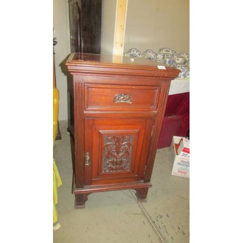 1583 - A mahogany cupboard with carved door and side panels, 95 x 56 x 56 cm.  COLLECT ONLY.