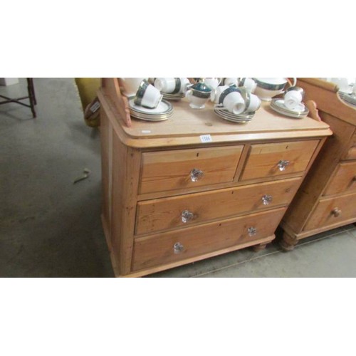 1586 - A Victorian pine chest of drawers with splash back and glass handles, 93 x 47 x 84 cm high, back 110... 