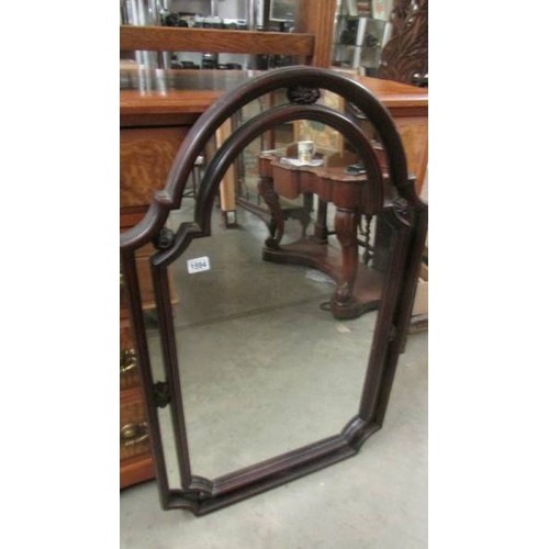 1594 - A mahogany arched top mirror. COLLECT ONLY.