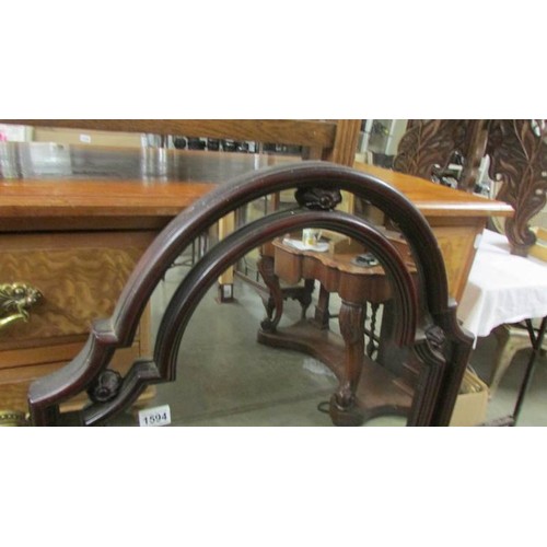 1594 - A mahogany arched top mirror. COLLECT ONLY.