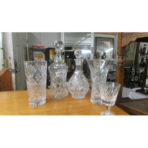 1595 - Two cut glass decanters and two cut glass vases. COLLECT ONLY.