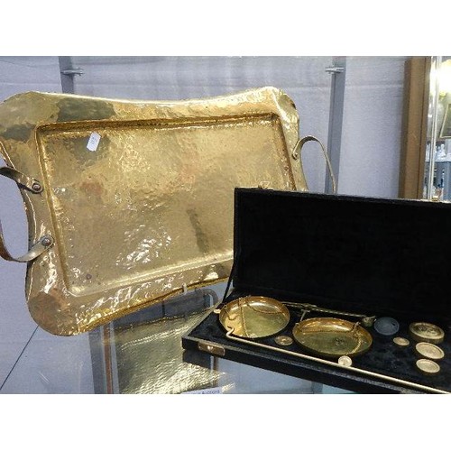 710 - A brass tray and a set of brass precious metal scales.