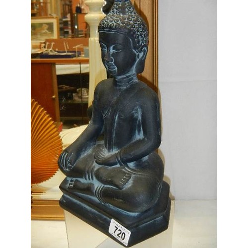 720 - A figure of a Buddha,