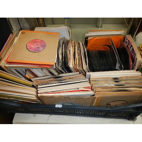 731 - A box of 45 rpm records and a box of CD's.