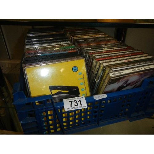 731 - A box of 45 rpm records and a box of CD's.