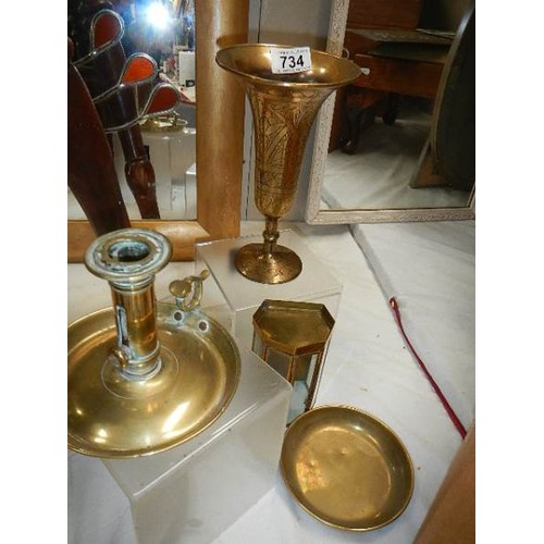 734 - A mixed lot of brassware including chamber candlestick.