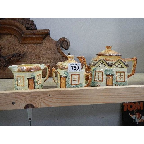 750 - A three piece cottage ware tea set.