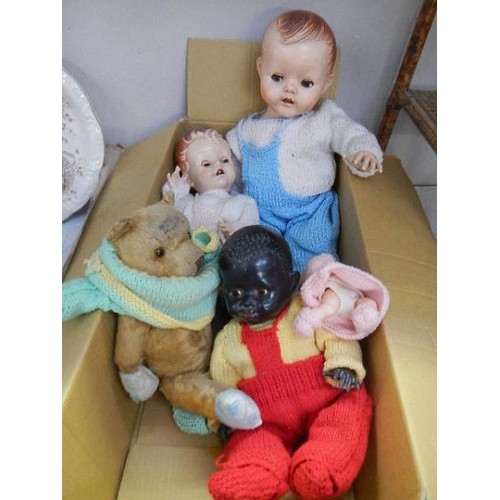 768 - Three vintage dolls and a vintage teddy bear.