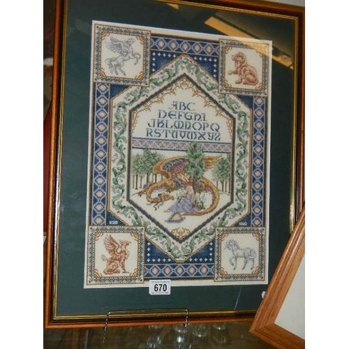 670 - Two framed and glazed cross stitch pictures.  COLLECT ONLY.