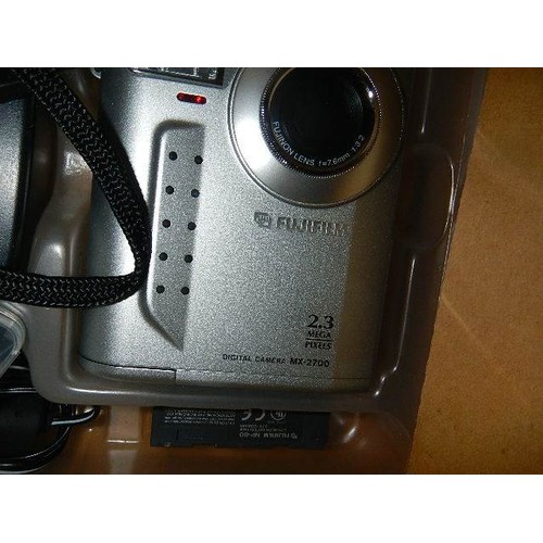 810 - A boxed Fujifilm X2700 camera.