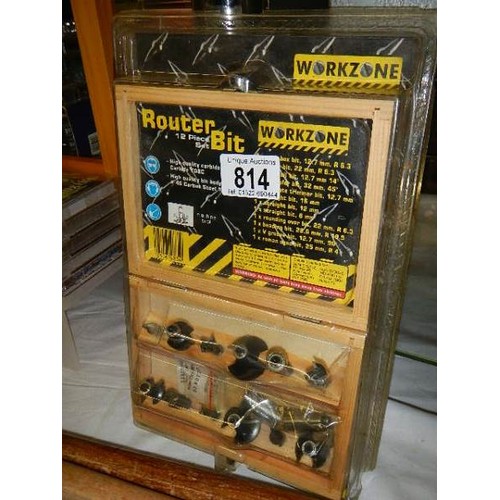 814 - A twelve piece router bit set.