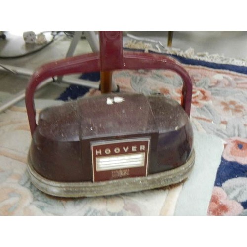 839 - An early Hoover vacuum cleaner.