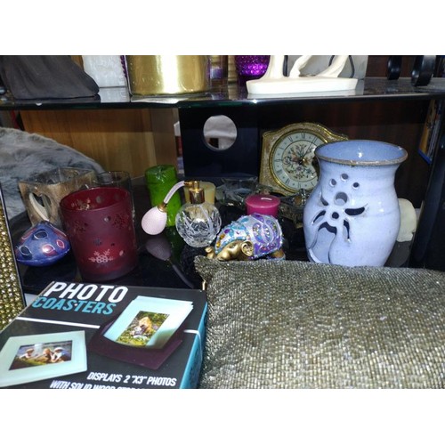 164 - A quantity of candles, candle holders, perfume bottle, frame & a cushion etc.