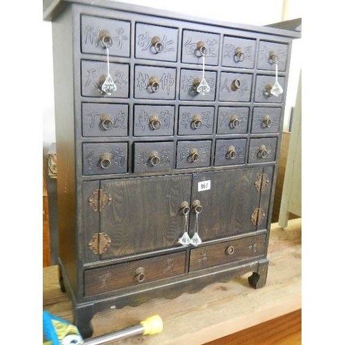 867 - An oriental style cabinet with 22 small drawers and 2 doors, COLLECT ONLY.