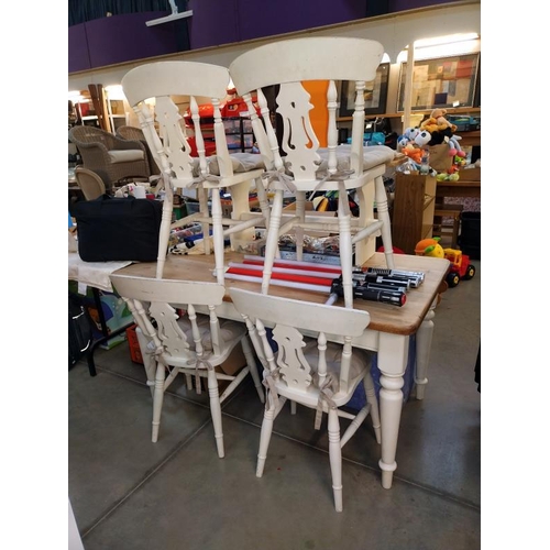 278 - A solid pine kitchen table with painted legs & 4 chairs & a bench (table 80cm x 145cm x 75cm high)