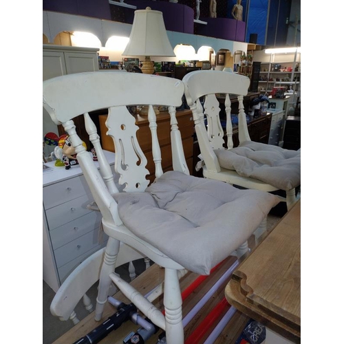 278 - A solid pine kitchen table with painted legs & 4 chairs & a bench (table 80cm x 145cm x 75cm high)