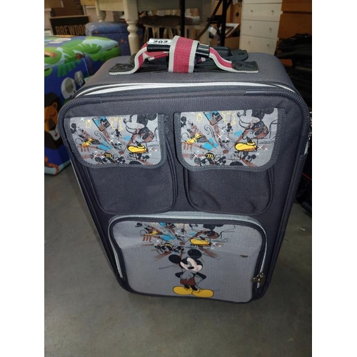 282 - A good selection of suitcases/travel cases including Mickey Mouse