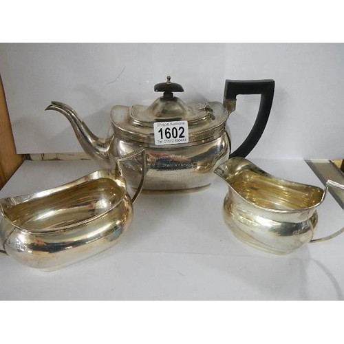 1602 - A three piece silver tea set, Birmingham, Barker Bros, approximately 29 ounces.