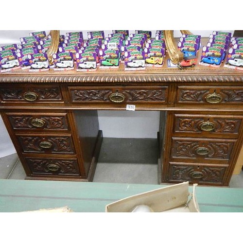 1609 - A Victorian carved oak double pedestal desk with leather inset top. COLLECT ONLY.