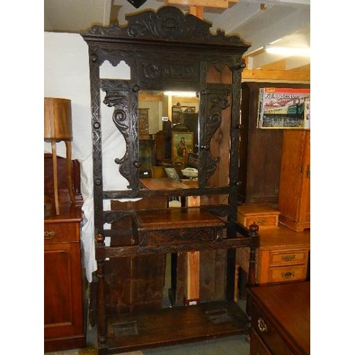 1629 - A carved oak hall stand. COLLECT ONLY.