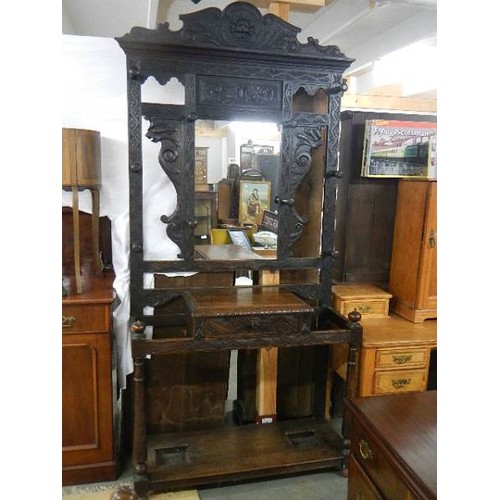 1629 - A carved oak hall stand. COLLECT ONLY.