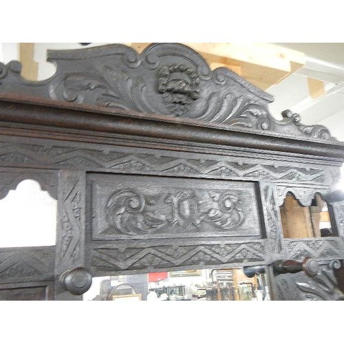 1629 - A carved oak hall stand. COLLECT ONLY.