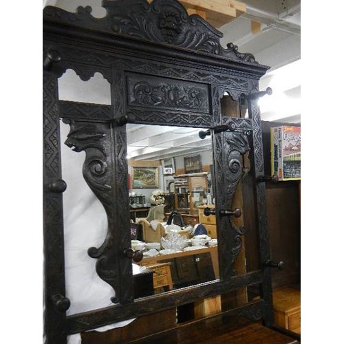 1629 - A carved oak hall stand. COLLECT ONLY.