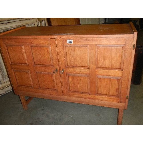 1630 - A pine sideboard with paneled doors, COLLECT ONLY.