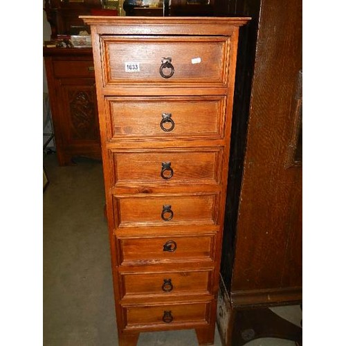 1633 - A slim seven drawer pine chest. COLLECT ONLY.