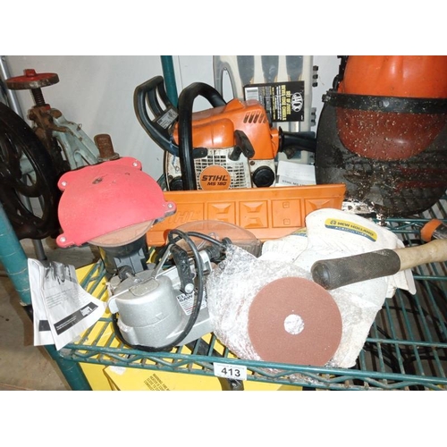 413 - A chainsaw, sharpener, protective head gear, box of chisels & level etc. COLLECT ONLY