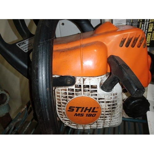 413 - A chainsaw, sharpener, protective head gear, box of chisels & level etc. COLLECT ONLY